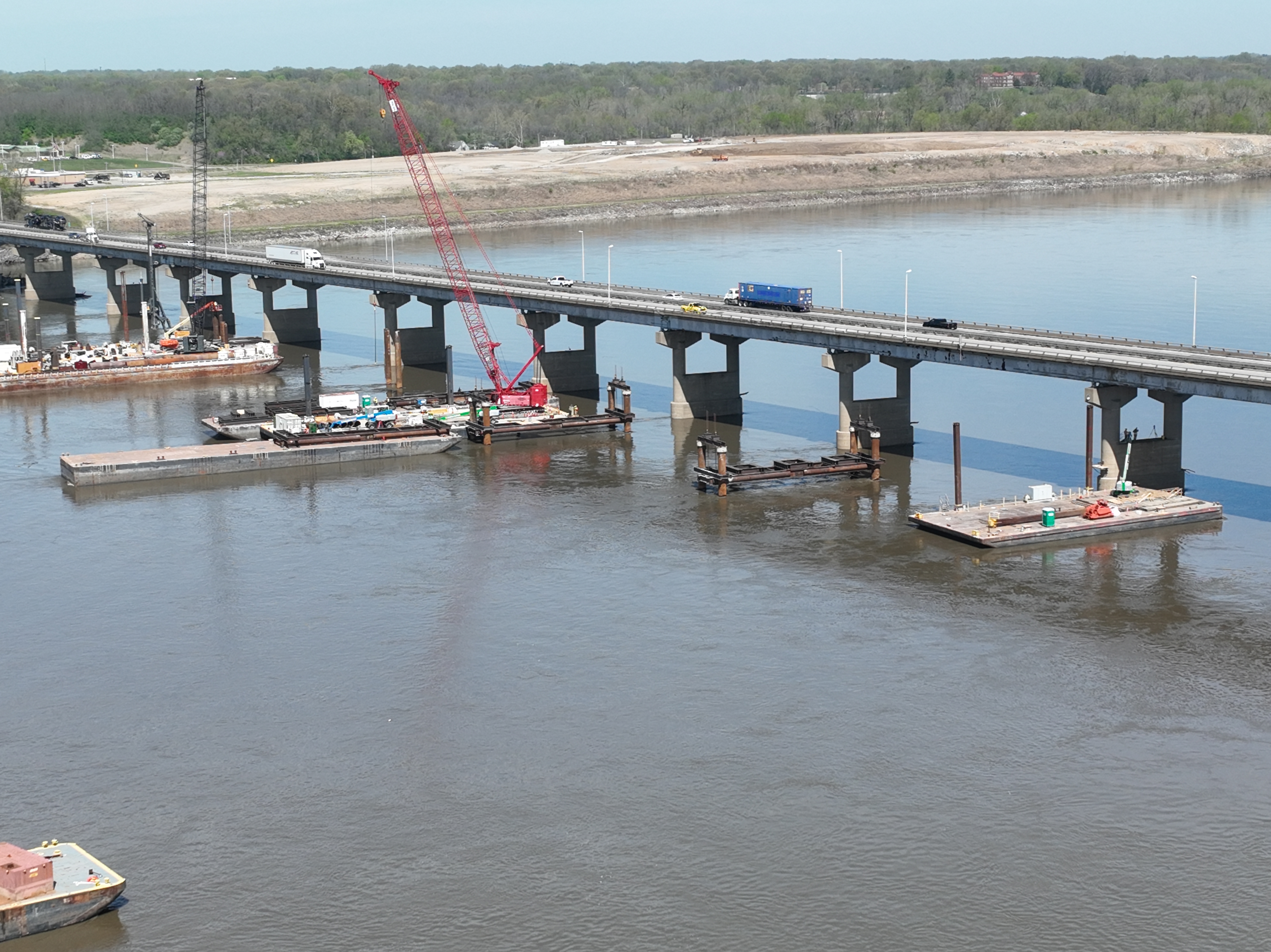 Aerial of barges in the river.