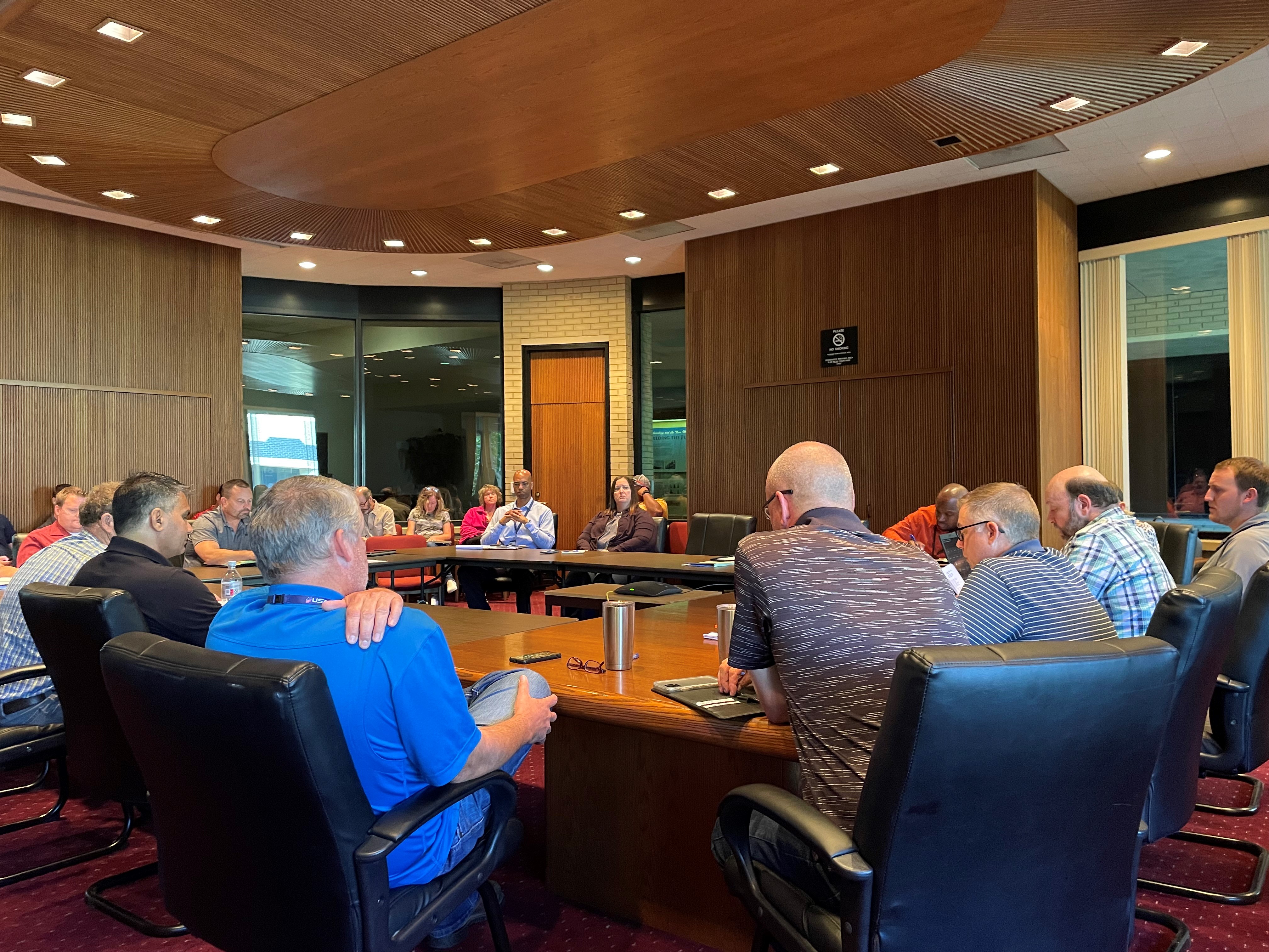 People gathered around a conference table.